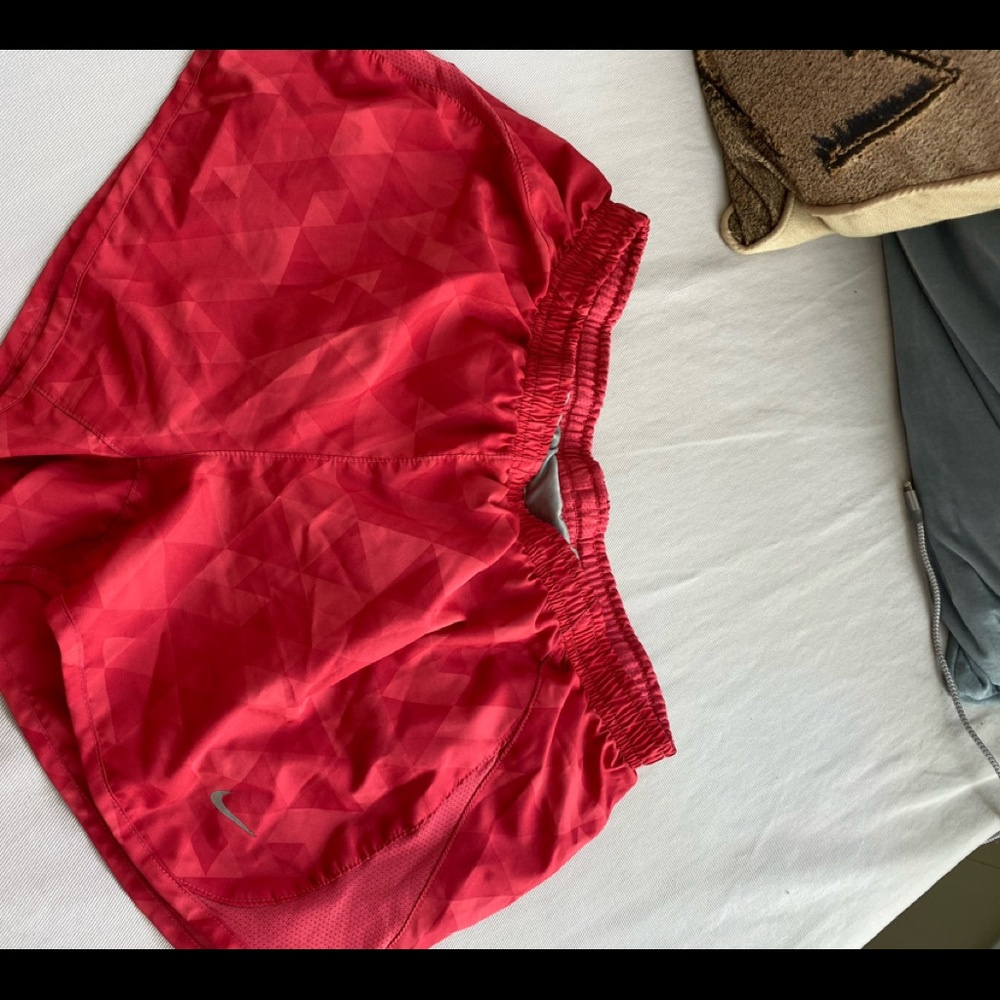 Pink Nike running shorts